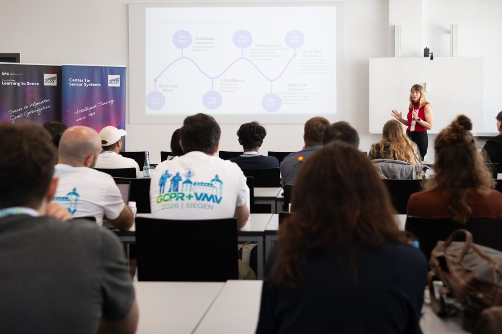 Data Scientist Dr Rachel Hegemann (Deutsche Bahn AG) during her talk at the Women in Vision Workshop at GCPR/VMV 2026, hosted by ZESS/Uni Siegen
